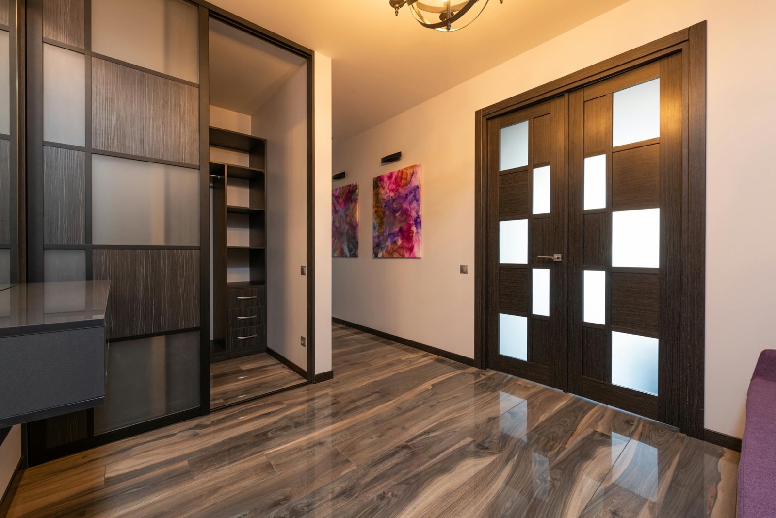 Hallway with modern glazed internal doors and polished floor